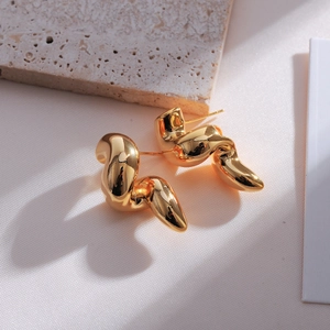 Minimalist double-layer twisted teardrop earrings in polished champagne gold finish