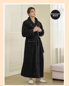 Close-up of thick black coral fleece robe showing silver striped trim and plush texture