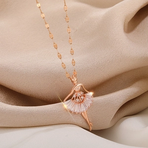 Detail of rose gold ballet dancer pendant with clear crystals on a delicate O-chain