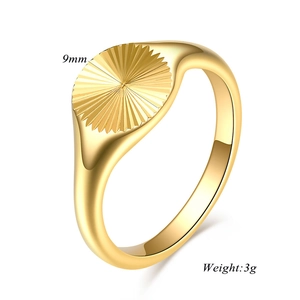 Detail of 9mm 18K gold plated stainless steel signet ring with radial sunburst texture