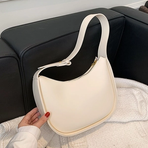 Sac bandoulière minimaliste en cuir blanc en forme de croissant avec zip doré
