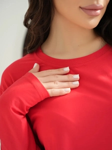 Close-up of the round neckline and soft knitted fabric texture on this red pajama top