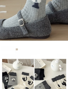 Detail of ribbed cotton mid-calf socks with cute cartoon animal patterns in Japanese style