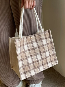 Minimalist canvas tote bag with brown checkered pattern and woven rope handles for daily use