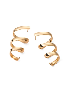 Detailed view of golden triple spiral hoop earrings with high-polish mirror finish