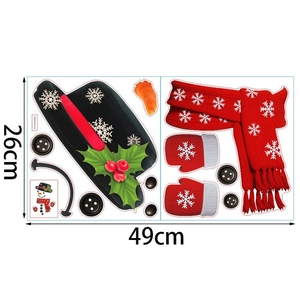 Detail view of 26x49cm DIY snowman wall sticker sheet with hat, scarf and carrot nose