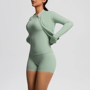 Sage green 3-piece yoga set showing zip jacket, slim tank top, and high-waist shorts detail