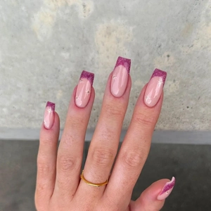 Pink French glitter coffin nails with white star accents and shimmering purple tips