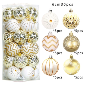 Detail view of 30pcs gold and white 6cm Christmas balls with diverse patterns and textures
