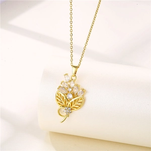 Detailed close-up of 18K gold plated necklace featuring floral zircon pendant on stone base