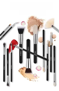 Detailed close-up of professional makeup brushes with soft synthetic bristles and matte handles