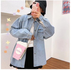 Fashionable pink coffee cup shaped crossbody bag paired with a blue denim shirt