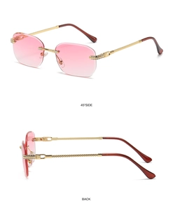Detail view of pink gradient rimless sunglasses with gold metal rhinestone-encrusted temples
