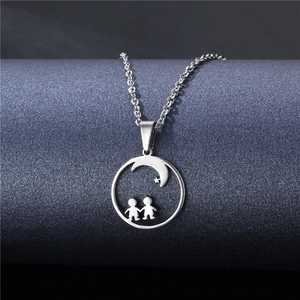Polished stainless steel necklace featuring a boy and girl silhouette under crescent moon