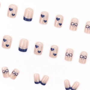 French blue bow and heart press-on nails with silver glitter edging on nude base