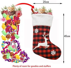 Red and black plaid Christmas stocking with reindeer snowflake appliques and size guide