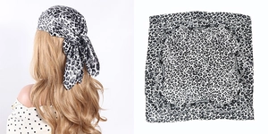 Black and white leopard print satin headscarf with chain border and model style view