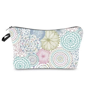 Detail view of colorful mandala pattern makeup bag with zipper and hand strap
