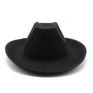 Detail view of the black wool felt texture and curved 8cm wide brim on the cowboy hat