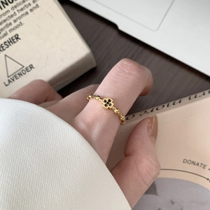 Minimalist 925 silver gold-plated ring with black zircon cross charm in a stylish setting