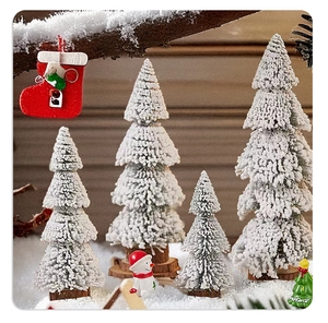Detailed view of flocked mini Christmas trees with pine needles and rustic wood bases