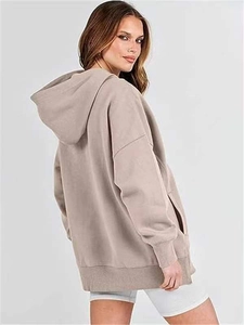 Detail of oversized taupe hoodie with ribbed cuffs and drop shoulder seam design