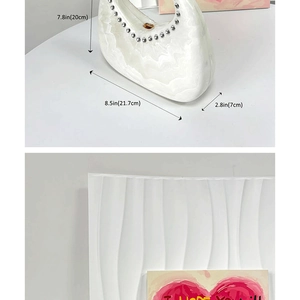 Detailed view of white ceramic vase with dimensions and wave texture with silver studs
