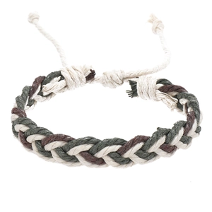 Detail view of handmade braided bracelet with brown green and beige adjustable cord