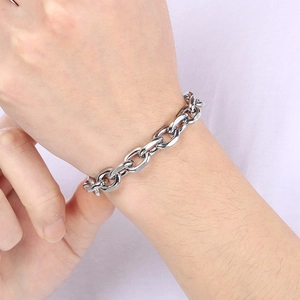 Silver stainless steel Cuban chain bracelet with OT buckle on wrist for modern unisex style