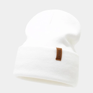 Detail shot of the vertical knit texture and brown leather label on the white beanie