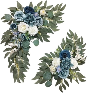 Detail of blue and white silk roses with eucalyptus leaves for seasonal home decoration