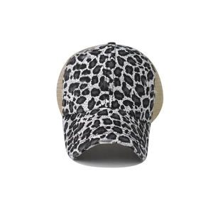 Detail of leopard print baseball cap featuring breathable mesh and washed fabric texture