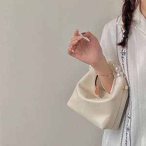 Elegant cream white pearl handle handbag with smooth PU leather in minimalist design