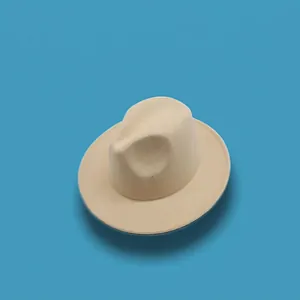 Top view of a cream-colored wool fedora hat with a wide brim on a bright blue background