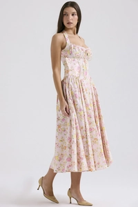 Detail of floral print maxi dress with halter neckline and slim fit corset bodice