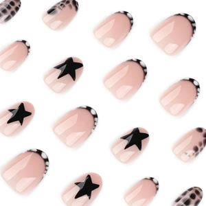 Y2K style short round press-on nails with black stars and leopard print designs