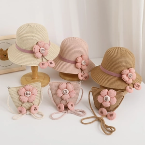 Detail of children's straw hat and bag set with 3D fabric flowers and cherry charms