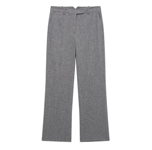 Detailed macro shot of grey wool texture fabric on formal straight-leg suit trousers