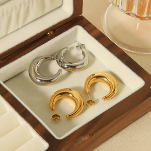 French vintage 18K gold and silver crescent hollow hoop earrings in a wooden jewelry box