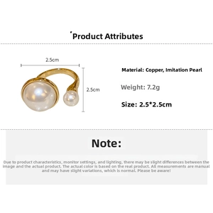 Detail view of irregular gold-plated open ring with two white pearls and size specifications