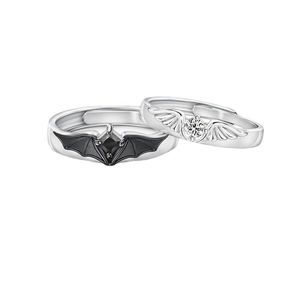 Silver angel and demon wing couple rings with black and white gemstones in open design