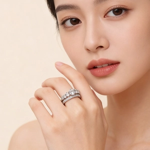 Close-up of double layered silver rings with sparkling cubic zirconia on a model's finger