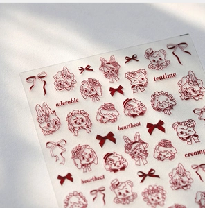 Detailed close-up of dark red vintage animal and bow-knot nail art stickers