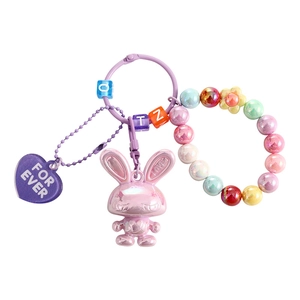Cute pink iridescent bunny keychain with colorful beaded bracelet and heart pendant
