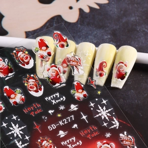 Detailed macro of 5D embossed Christmas nail stickers featuring Santa and snowflakes