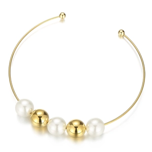 Minimalist gold collar necklace with white pearls and gold beads on white background