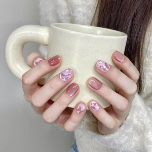 Pink cat eye press-on nails with butterfly sequins and aurora glitter short round design