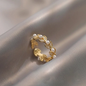 Elegant French wheat ear open ring with pearls and zircons on silver satin background