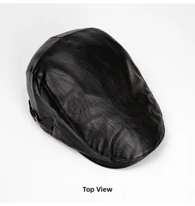 Top view of a black faux leather newsboy cap showing detailed stitching and premium texture