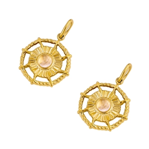 Detail of two gold stainless steel sunburst pendants with translucent round gemstone